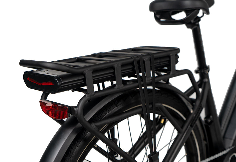 Rear view of an electric bicycle with a mounted battery pack on the cargo rack and rear light.