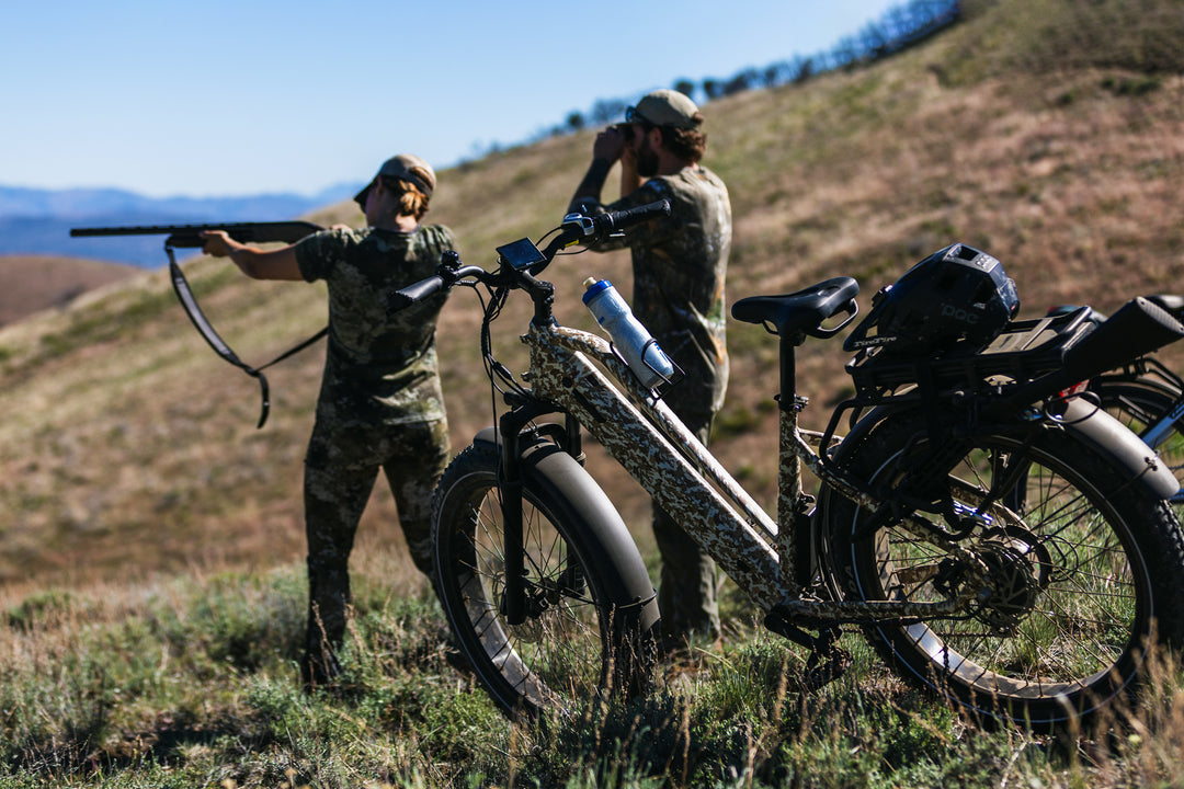 Two person Hunting stationary shot of the Dirwin Pioneer Plus Offroad Fat Tire Electric Bike outdoors