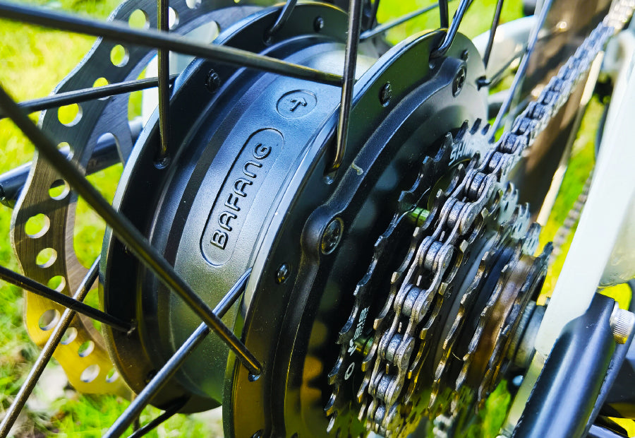 Close-up of a Bafang electric bike motor with a Shimano gear cassette and brake disc.