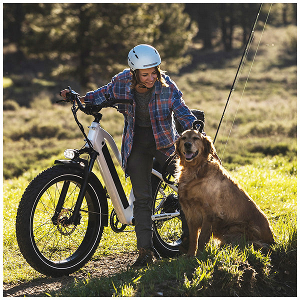 Customers on their Dirwin fat tire electric bikes going fishing with their dog