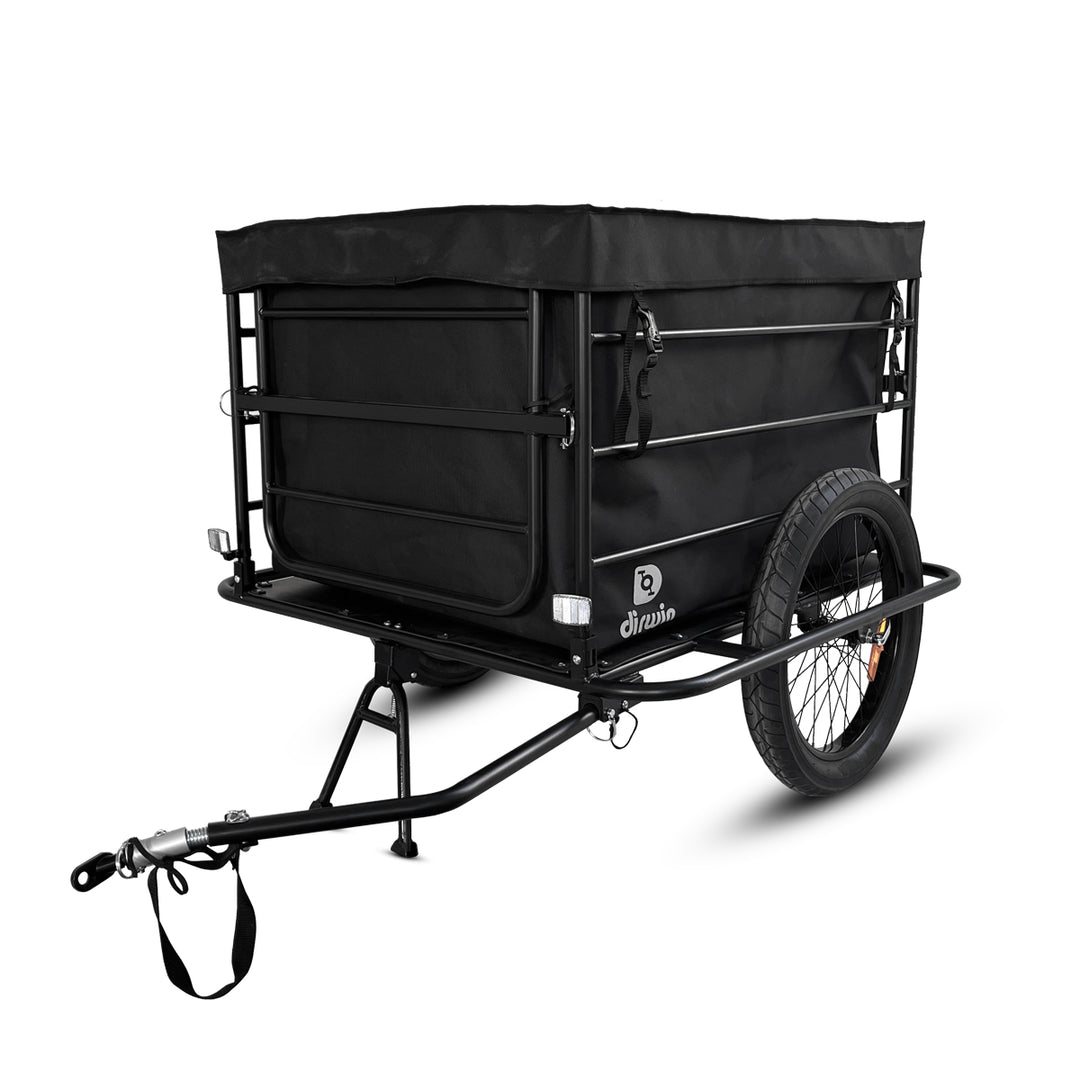 Black cargo bike trailer with sturdy frame and two wheels, designed for easy transportation and storage.