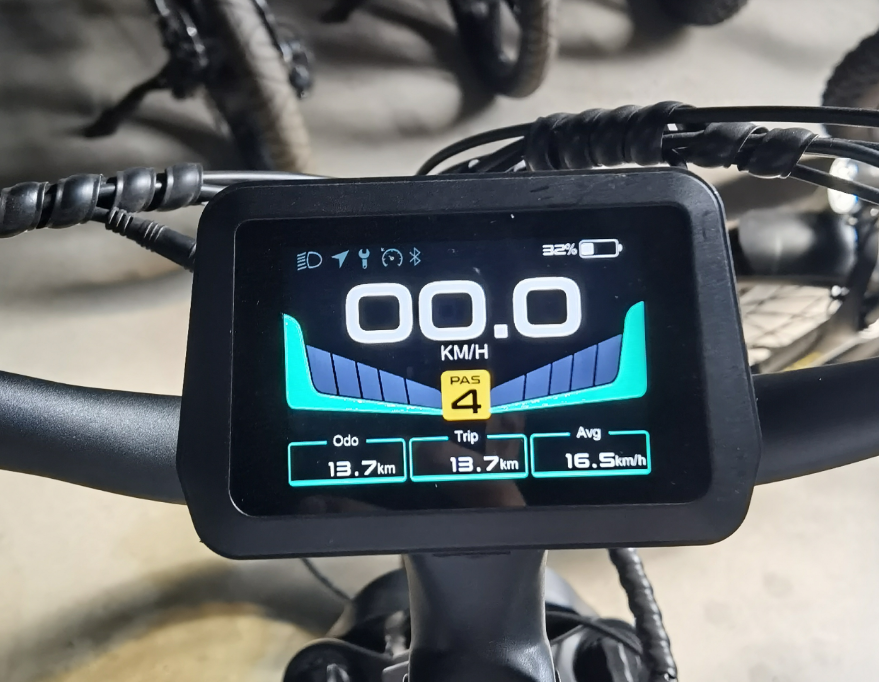 Extra large color digital display on a bicycle handlebar showing speed and other metrics.